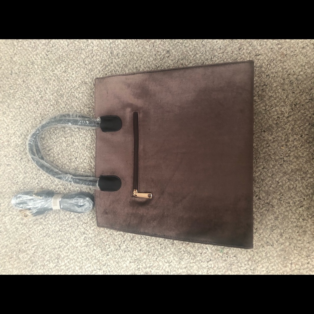 Brand new tags on besslism handbag